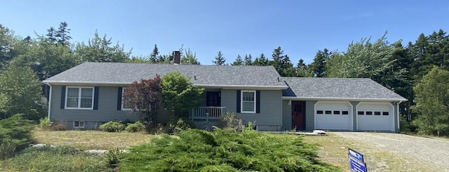 ranch-style home with driveway and a garage