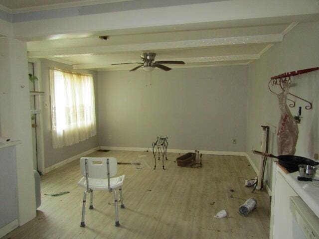 miscellaneous room featuring beam ceiling and light hardwood / wood-style flooring