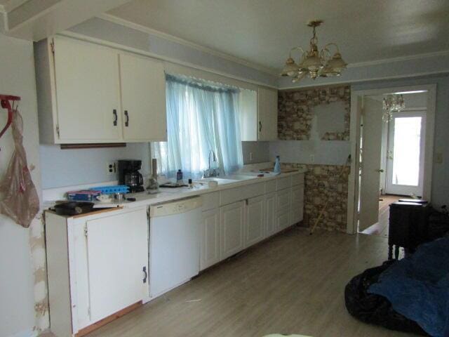 kitchen featuring white cabinetry, dishwasher, a chandelier, and sink