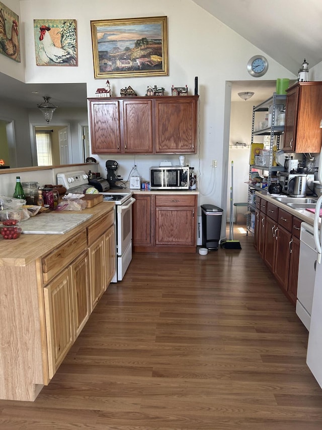 30 Steamboat Rd, Swans Island, ME 04685 - kitchen with dark wood finished floors, white appliances, light countertops, and a peninsula