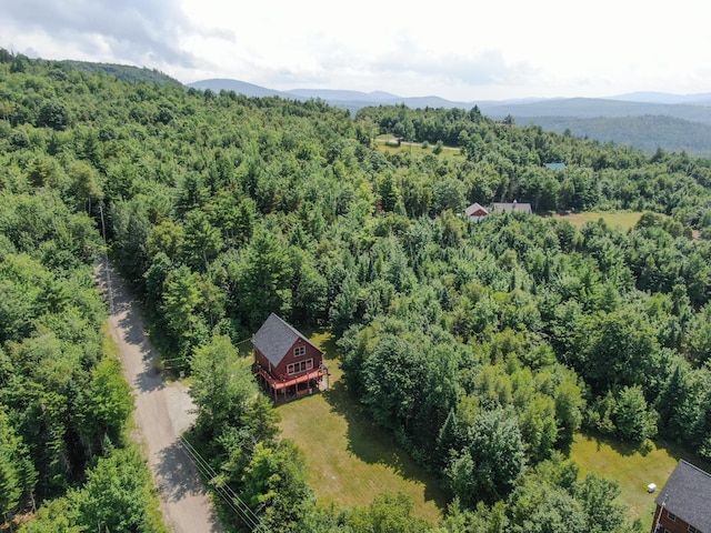 aerial view with a mountain view and a wooded view