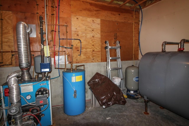 utility room with gas water heater, a heating unit, and heating fuel