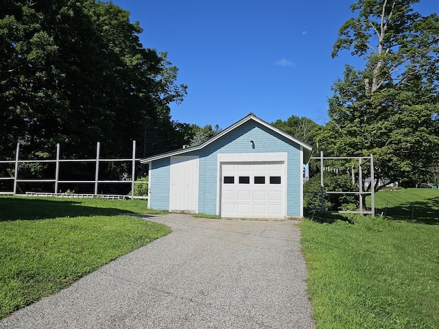 detached garage featuring driveway