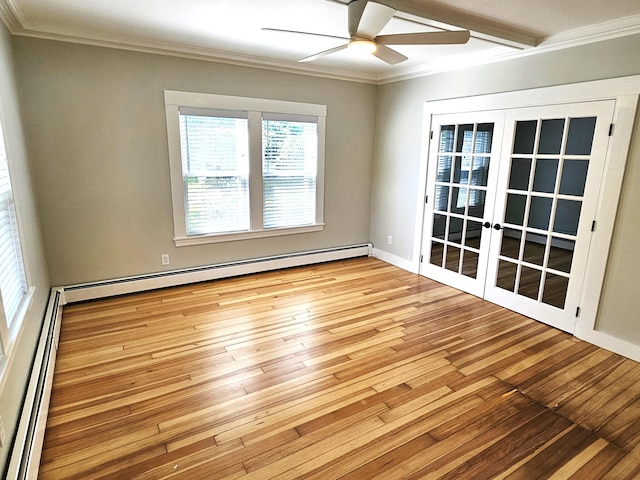 spare room with a baseboard radiator, baseboard heating, wood-type flooring, ornamental molding, and french doors