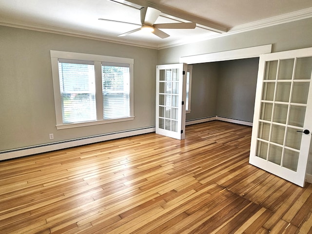 spare room featuring baseboard heating, wood-type flooring, a ceiling fan, french doors, and crown molding
