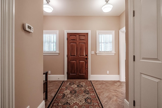 entryway with light parquet flooring