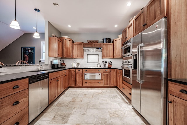 kitchen with lofted ceiling, hanging light fixtures, stainless steel appliances, and sink