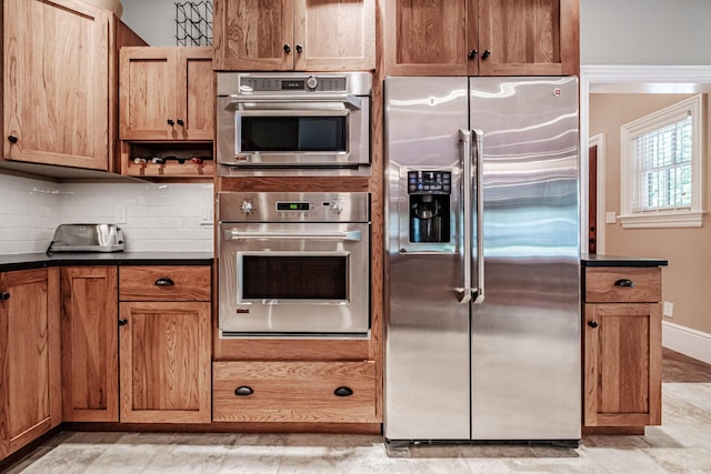 kitchen with backsplash and stainless steel refrigerator with ice dispenser