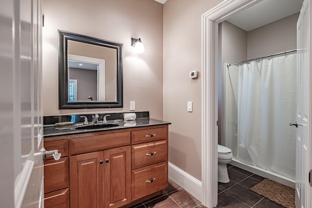 bathroom featuring vanity, tile patterned flooring, curtained shower, and toilet