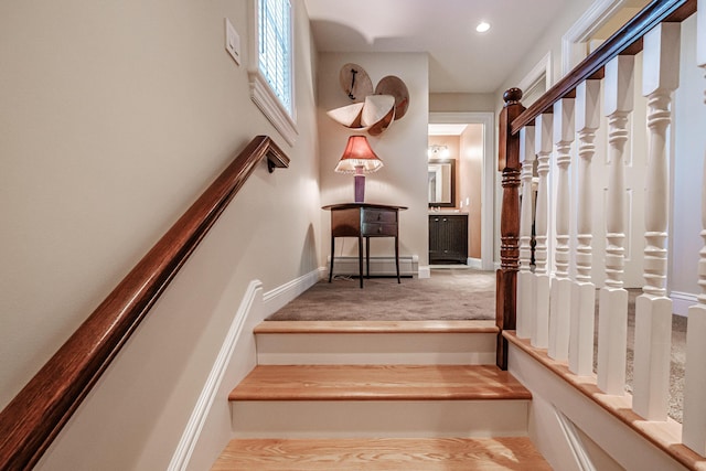 staircase with a baseboard radiator