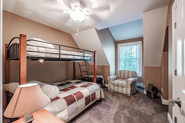 carpeted bedroom featuring vaulted ceiling and a baseboard heating unit