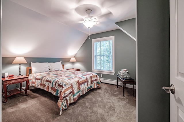 carpeted bedroom with a baseboard radiator, ceiling fan, and vaulted ceiling