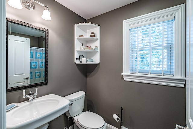 bathroom with toilet and sink