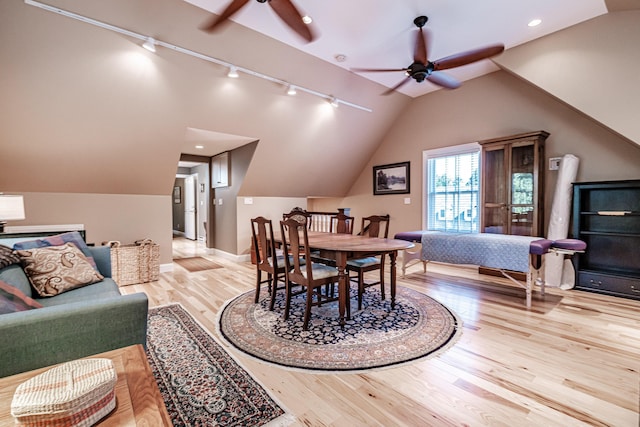 interior space with vaulted ceiling, ceiling fan, and light wood-type flooring