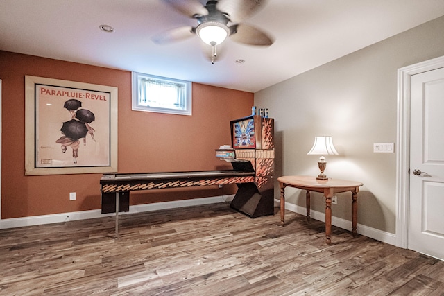 misc room with hardwood / wood-style flooring and ceiling fan