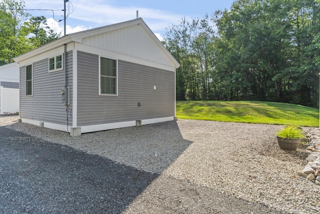 view of home's exterior featuring a yard