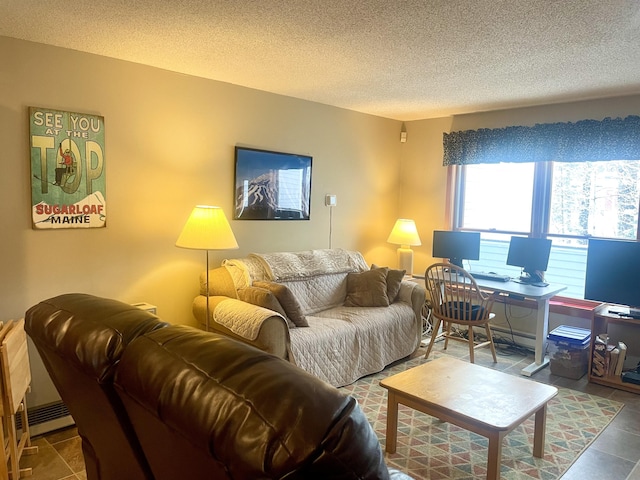 living room with a textured ceiling and tile patterned flooring