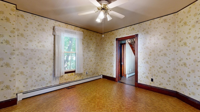 empty room with ceiling fan and a baseboard radiator