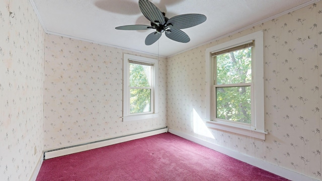 carpeted empty room with crown molding, ceiling fan, and a baseboard radiator