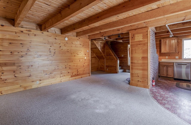 interior space featuring wooden ceiling, light colored carpet, wood walls, and beamed ceiling