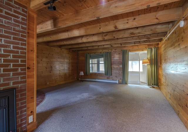 interior space featuring a baseboard radiator, wooden walls, and beam ceiling