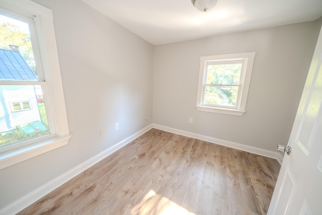 unfurnished room featuring light hardwood / wood-style floors