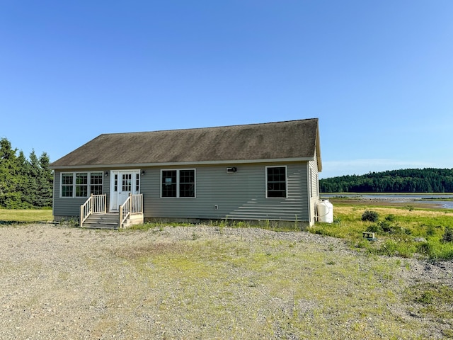 view of front facade with a shingled roof