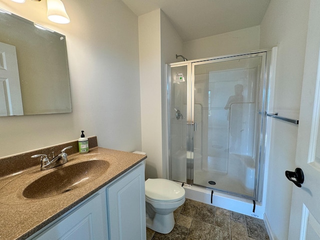 full bath with vanity, toilet, and a stall shower