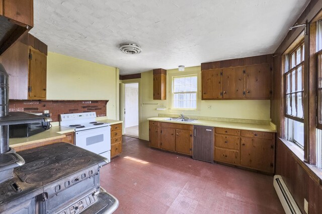 kitchen with light countertops, white electric range, a baseboard radiator, a sink, and dishwashing machine