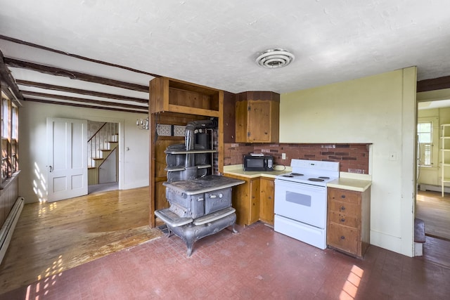 kitchen featuring light countertops, black microwave, brown cabinetry, white electric range oven, and visible vents