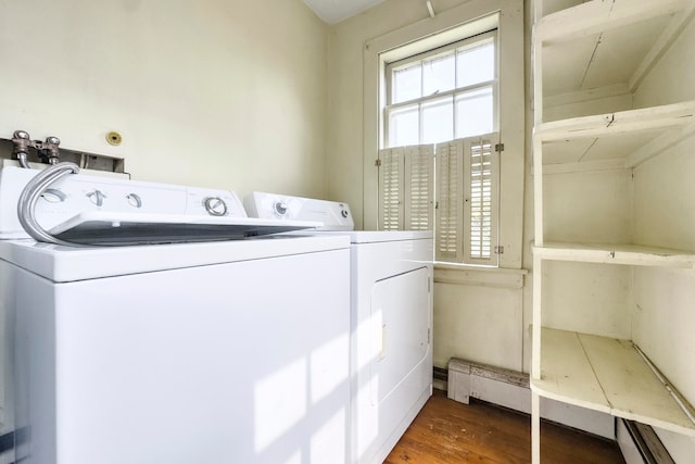 clothes washing area featuring hardwood / wood-style floors and independent washer and dryer