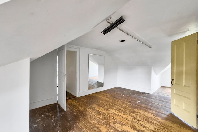 bonus room featuring lofted ceiling and hardwood / wood-style floors