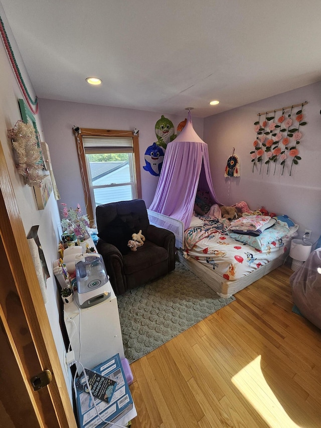 bedroom with wood-type flooring