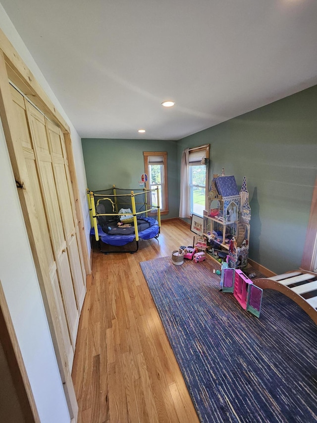 playroom with light hardwood / wood-style floors