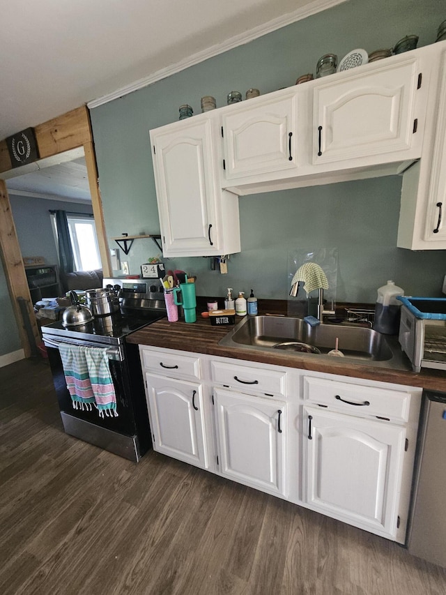 kitchen featuring white cabinetry, sink, dishwashing machine, dark hardwood / wood-style flooring, and stainless steel range with electric stovetop