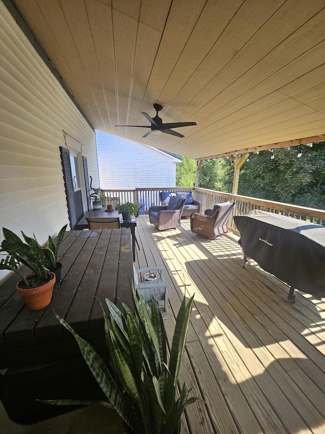 wooden deck featuring ceiling fan and an outdoor hangout area