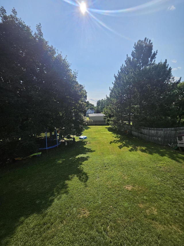 view of yard featuring a trampoline