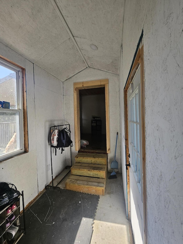 corridor with lofted ceiling