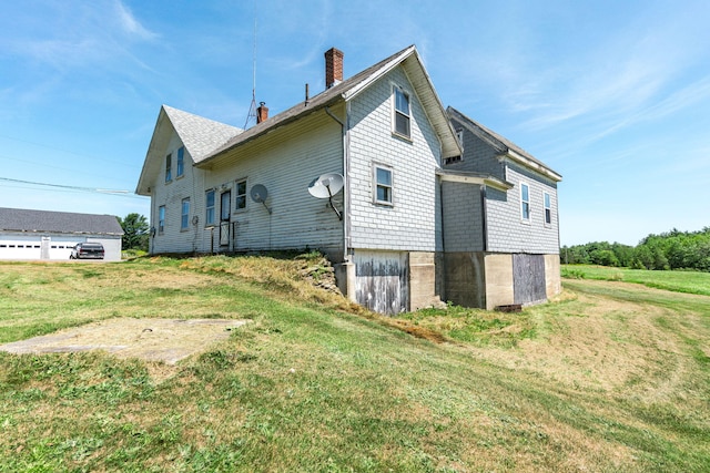 view of property exterior with a yard