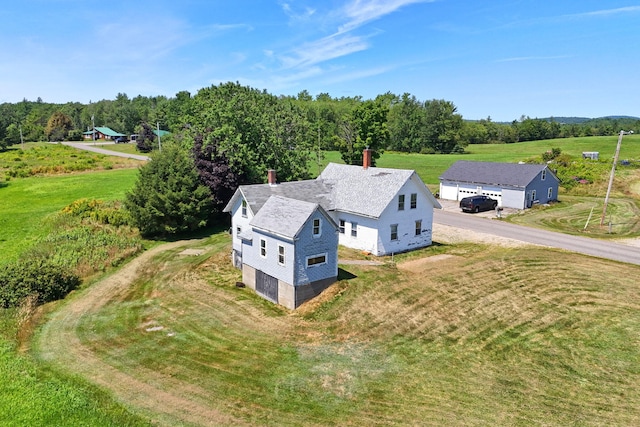 birds eye view of property with a rural view