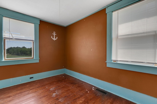 spare room featuring hardwood / wood-style flooring