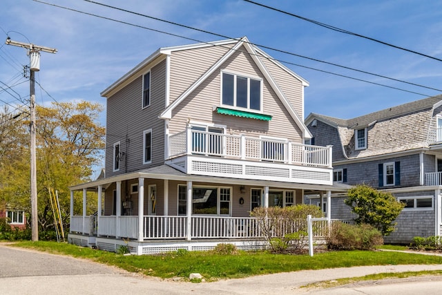 view of front of home featuring a balcony and a porch