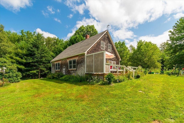 view of home's exterior featuring a yard