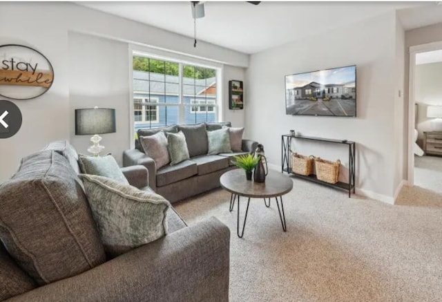 living room with carpet floors and baseboards