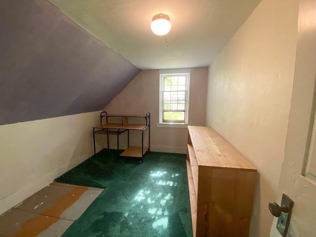 bonus room featuring carpet floors, baseboards, and lofted ceiling