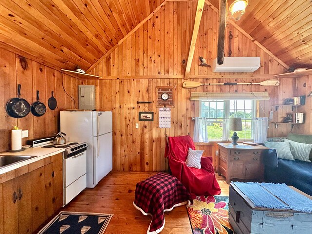 kitchen with wooden walls, lofted ceiling, and hardwood / wood-style flooring