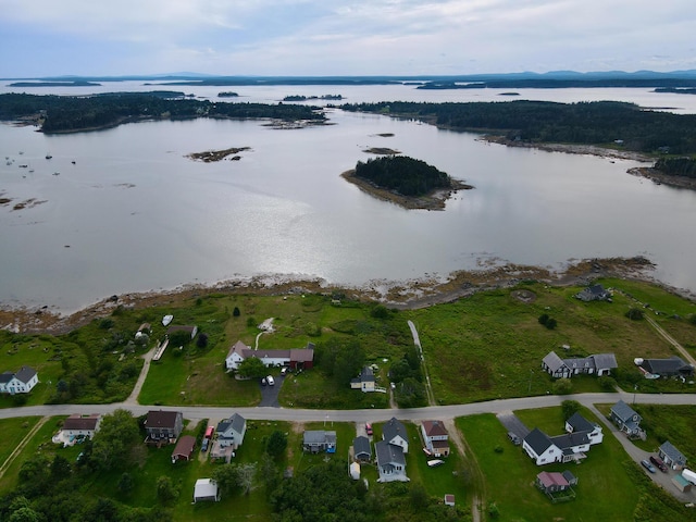 drone / aerial view featuring a water view and a residential view