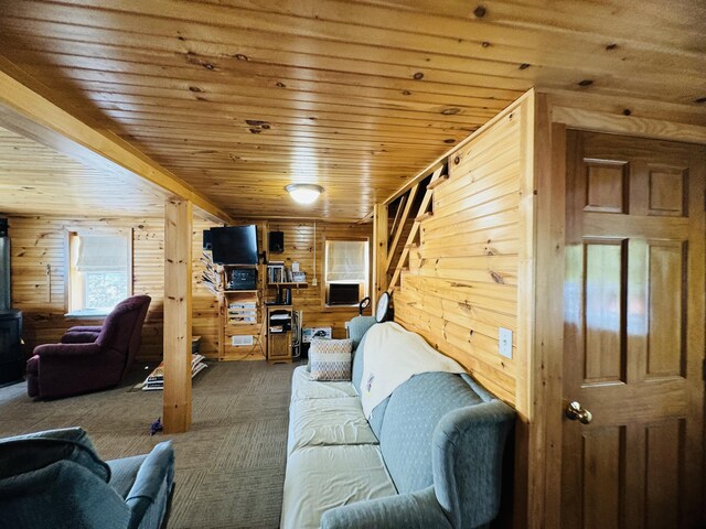 carpeted living room with wooden walls and wood ceiling