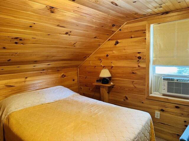 unfurnished bedroom with wood walls, vaulted ceiling, and wood ceiling