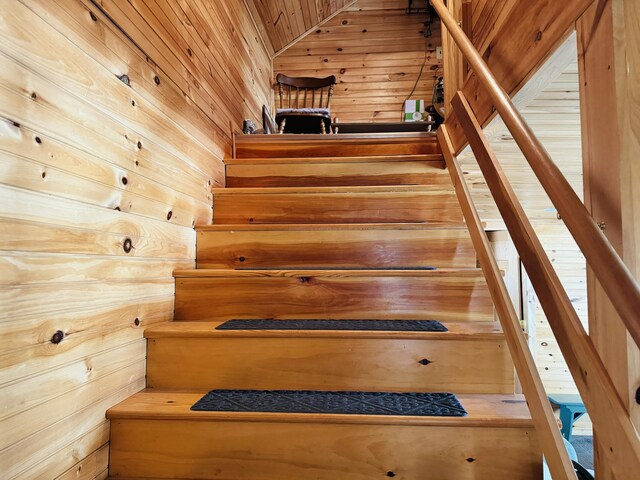 stairway with wooden walls